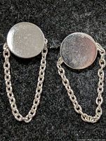 front view of both earrings showing disc fronts and chain
