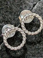 front view of both rope circle earrings with 925 markings visible