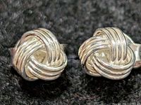 close-up front view of both knot stud earrings