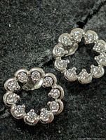 front view of both earrings showing circular design and stones