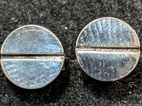 front view of both earrings showing circular shape and groove