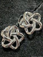 Front view showing knot design of both earrings