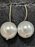 frontal view showing both pearls and silver hooks