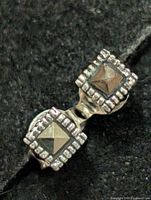 close-up of front view showing marcasite pyramid centres and beaded borders