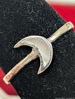 Front view of silver ring showing crescent moon mother of pearl inlay