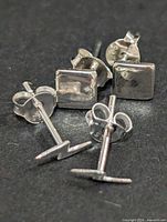 Both earring pairs showing fronts and backs with 925 stamps