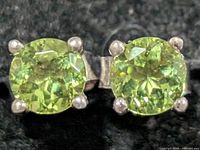 Front view showing peridot stones and prong settings