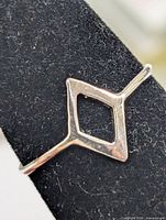 Front view showing open diamond design on ring