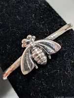 Front view showing bee detail on ring
