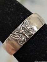 front view showing butterfly motif on silver toe ring