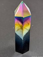 Front view of titanium aura obsidian tower showing rainbow sheen and pointed apex