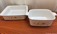 Both CorningWare dishes side-by-side showing shapes and pattern