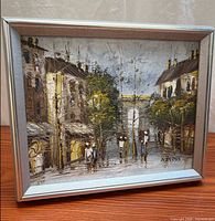 Front view of framed oil painting