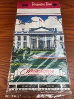 Front of sealed package showing White House illustration and calendar months February and March