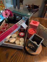 Group shot of all candles, holders, frame and accessories on table