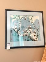 Full framed print on wall with birds on snowy branch