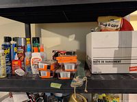 Overall view of shelf with insecticides, repellents, bait stations and slug killer bag