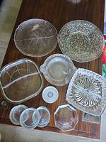 All 12 glass pieces laid out on table