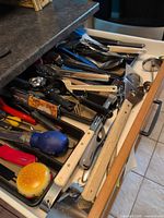 Drawer view showing majority of assorted utensils