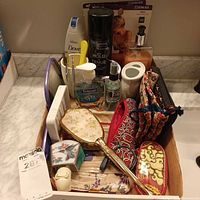 Overview of lot showing brush, night lights, toiletries, cosmetic bags