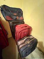 Stacked view of Bugatti roller bag, Antler suitcase, Josef duffel