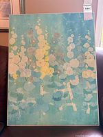 Front view of abstract floral art print on board