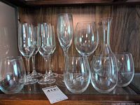 All 12 glass pieces: champagne flutes, stemless glasses, red wine glass, carafe