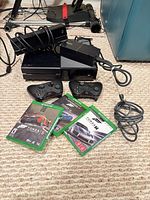 Full lot: console, Kinect, two controllers, power supply, cable and three Forza game cases