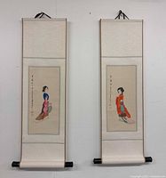 Full view of both scroll paintings hanging