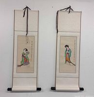 Full view of both scroll paintings hanging to show size and design