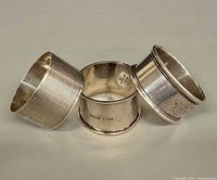 Three sterling napkin rings group view
