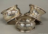 Three sterling napkin rings grouped front view