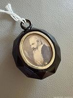 Front view showing portrait photograph and bezel