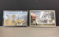 Both Morgan Mint coin sets front view