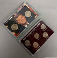 Front of both coin sets showing titles and coin faces