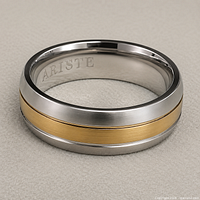 Ring angled view showing cobalt body, yellow gold inlay, interior engraving