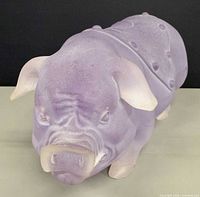 front angled view of lavender frosted glass pig figurine