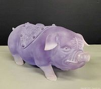 Left-front view of purple frosted glass pig figurine