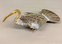 Left side view showing full ibis form and etched detail