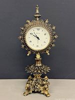 Front view showing entire brass mantel clock