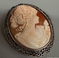 Front view of shell cameo in silver frame