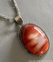 Front view of agate pendant on silver chain