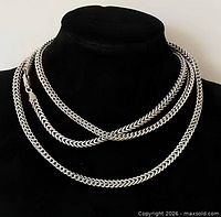 Full view of silver wheat chain necklace displayed doubled on bust