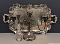 Tray, candelabrum and salt shaker grouped to show scale and condition