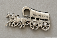 Front view displaying oxen, wagon, and engraved text