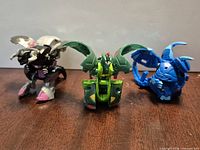 Three Bakugan figures fully opened