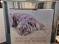 Natural Worlds book in slipcase, visible cover tiger image