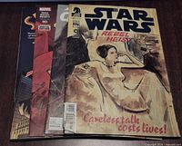 Stack of three comics: Rebel Heist, Spider-Man #003, Chewbacca #002