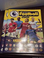 Front covers of both Panini Football 2020 albums