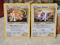 Front view of both cards side by side showing condition, artwork, HP, attacks, and set numbering